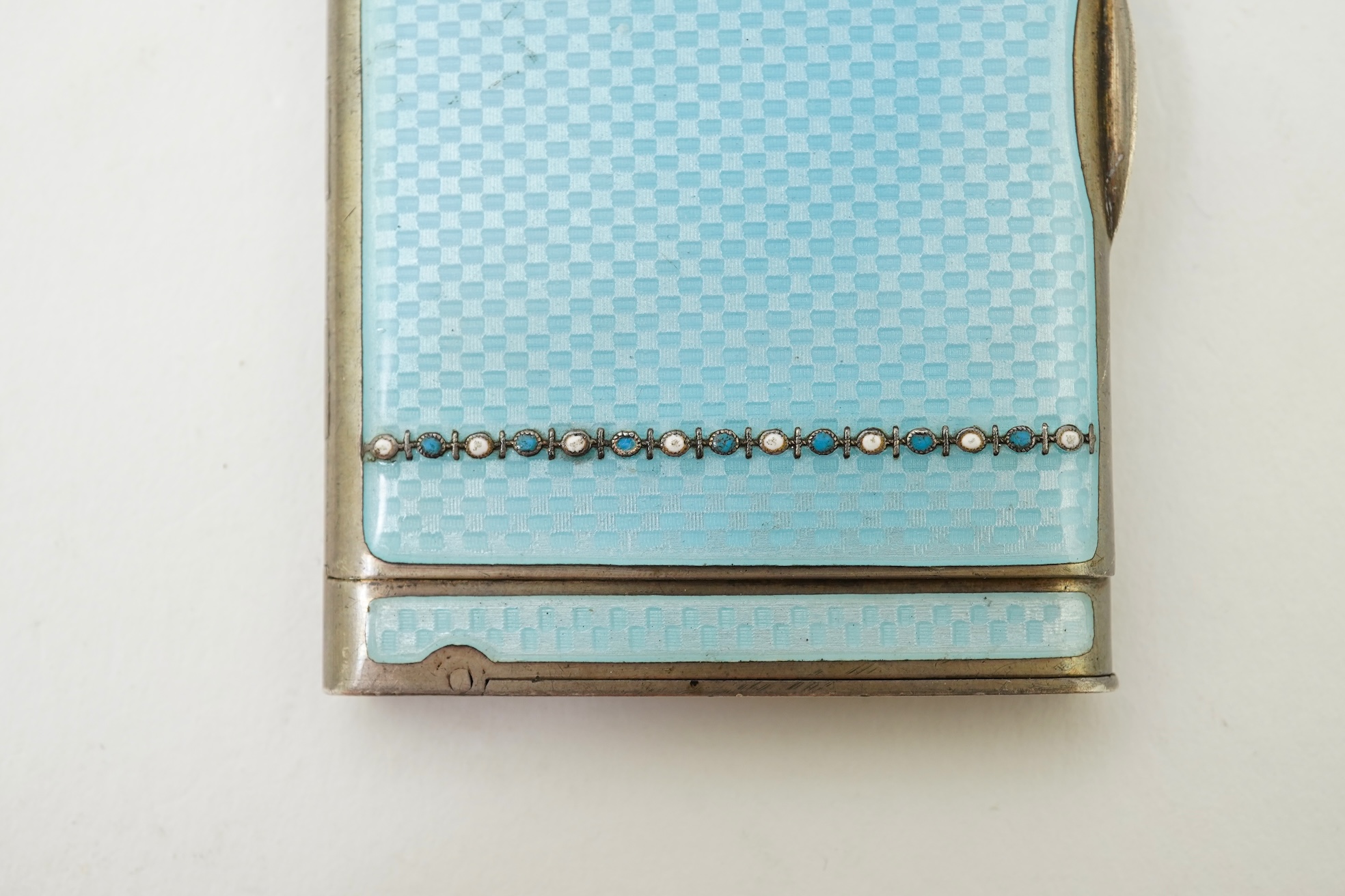 An early 20th century Viennese sterling and blue enamel combination cigarette/vesta case, inscribed Carl Heiss Wien Graben 11